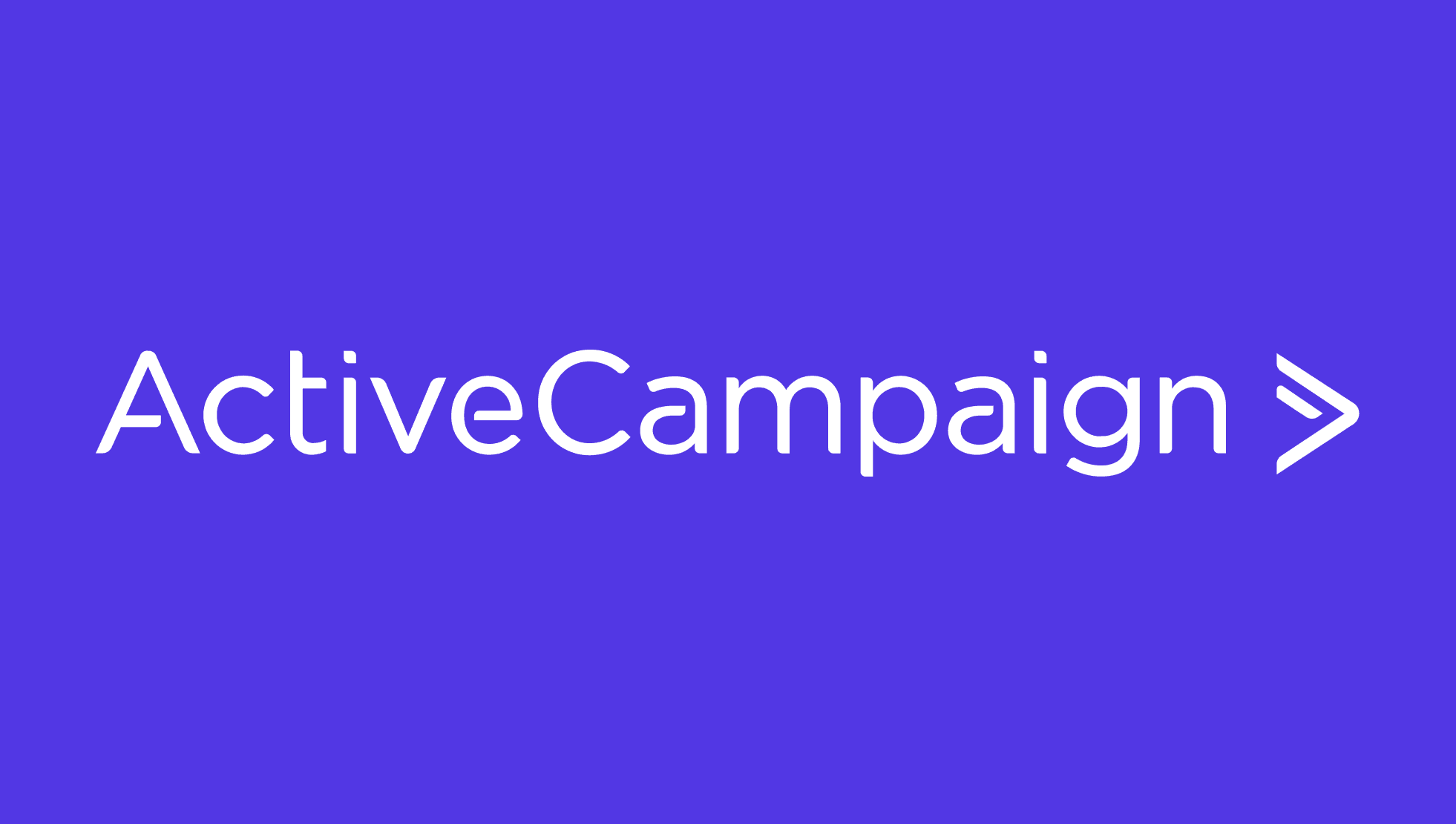 ActiveCampaign: a minimalist logo-style title screen featuring the brand name in large white sans-serif letters centered on a solid purple background, with a stylised white right-facing chevron/arrow immediately to the right of the text.
