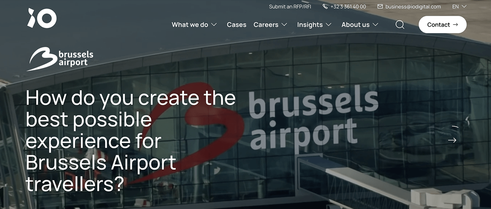 Brussels Airport (case study hero banner) â The screenshot depicts a website hero banner for a Brussels Airport case study, featuring a darkened image of the airport terminal with the âbrussels airportâ text and red swoosh logo, a jet bridge in the foreground, and prominent white headline asking about optimizing traveller experience, with a âView the case ââ CTA.