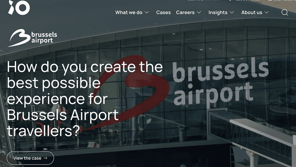Brussels Airport (case study hero banner) â The screenshot depicts a website hero banner for a Brussels Airport case study, featuring a darkened image of the airport terminal with the âbrussels airportâ text and red swoosh logo, a jet bridge in the foreground, and prominent white headline asking about optimizing traveller experience, with a âView the case ââ CTA.